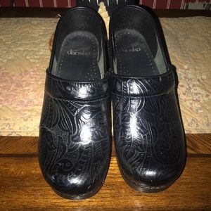 Dansko clogs. Tooled leather.